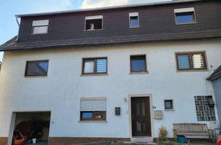 Haus kaufen in 35716 Dietzhölztal, Zweifamilienhaus mit großem Garten und Garage