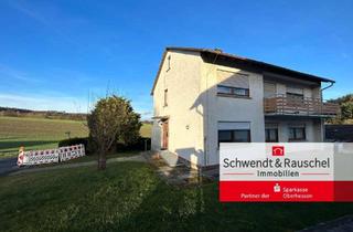Haus kaufen in 36323 Grebenau, Zweifamilienhaus mit Garten und Garage in Grebenau-Udenhausen