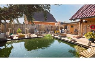 Haus kaufen in 24628 Hartenholm, Schickes EFH mit Sauna, Teich, Garten, drei Garagen und einem Bootsschuppen in Hartenholm