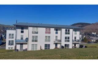 Wohnung kaufen in 57334 Bad Laasphe, Eigentumswohnung verteilt über zwei Etagen mit Balkon und PKW Stellplatz