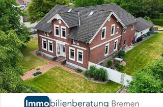 Haus kaufen in 27612 Loxstedt, Zweifamilienhaus mit drei Garagen und großem Garten