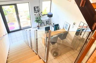 Wohnung kaufen in 64569 Nauheim, ZENTRALE WOHNOASE - Attraktive Maisonette-Wohnung mit 3 Wohnebenen, 2 Balkonen und Garage in Toplage