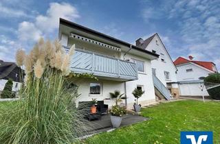 Einfamilienhaus kaufen in 36251 Bad Hersfeld, Ruhig gelegenes Einfamilienhaus mit einer vermieteten Dachgeschosswohnung und Garten