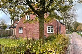 Haus kaufen in 26802 Moormerland, Zweifamilienhaus in idyllischer Lage von Moormerland-Tergast