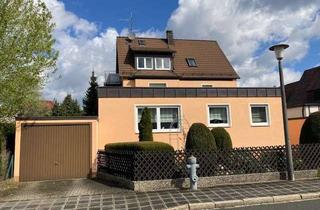Haus kaufen in 90571 Schwaig bei Nürnberg, Gepflegtes Dreifamilienhaus mit drei Garagen und Werkstatt in Schwaig