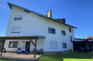 Haus kaufen in 56412 Heiligenroth, Heiligenroth - Dreifamilienhaus mit besonderer Architektur