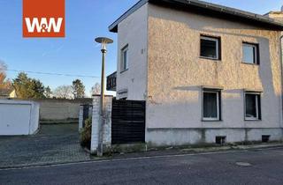 Haus kaufen in 53359 Rheinbach, Charmanter Handwerkertraum mit fünf Garagen und kleiner Hoffläche in Rheinbach!