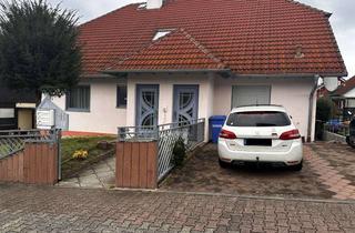 Haus kaufen in 55237 Bornheim, Mehrparteienhaus mit drei Wohnungen, großzügigem Garten und schöner Loggia