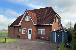 Haus kaufen in 26847 Detern, Zweifamilienhaus in ruhiger Randlage in Detern