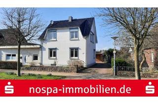 Einfamilienhaus kaufen in 24794 Borgstedt, Teilunterkellertes, einseitig angebautes Einfamilienhaus mit Gartenteich und Carport!