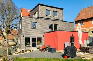 Haus kaufen in 96106 Ebern, Ebern - EINZIGARTIGE LAGE: Umfassend energetisch modernisiertes Haus mit 4 Wohnungen und sonnigem Garten im altstadtnahen Grün!