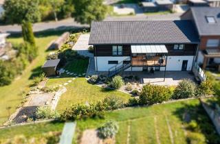 Haus kaufen in 97286 Winterhausen, Winterhausen - Hochwertige und energieeffiziente Immobilie vereint modernes Wohnen und Arbeiten in sehr guter Lage
