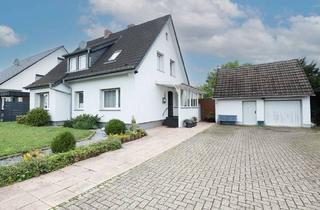 Einfamilienhaus kaufen in 49163 Bohmte, Bohmte - Einfamilienhaus mit Einliegerwohnung, Garage und großer Gartenoase!