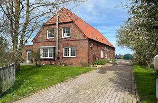 Haus kaufen in 26969 Butjadingen, Butjadingen - Malerisches Landhaus in Alleinlage mit Wiesenblick!
