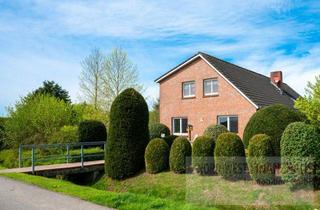 Haus kaufen in 26802 Moormerland, Gepflegtes Zweifamilienhaus in ruhiger ländlicher Lage mit Photovoltaikanlage