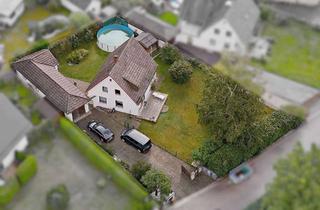 Einfamilienhaus kaufen in 82538 Geretsried, Renovierungsbedürftiges Einfamilienhaus in sonniger Lage mit Nebengebäude