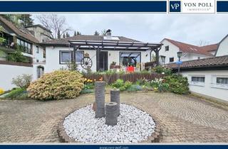 Einfamilienhaus kaufen in 61276 Weilrod, Weilrod - Gemütliches Einfamilienhaus mit Kamin, liebevoll angelegtem Garten, Fernblick und zwei Garagen