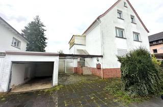 Mehrfamilienhaus kaufen in 65779 Kelkheim (Taunus), "Potenzial für Investoren und Familien: Sanierungsbedürftiges Mehrfamilienhaus mit drei Einheiten!"