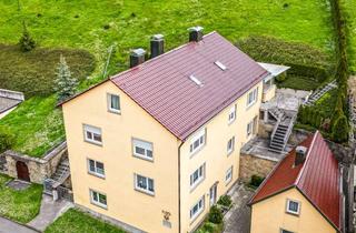 Haus kaufen in 97252 Frickenhausen am Main, MFH in Frickenhausen zvk., Bj 1961/1973, 250 m² Wfl., 1.284 qm Grd., mit Nebengebäude