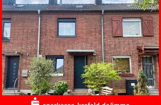 Haus kaufen in 47839 Krefeld, Krefeld - Vermietetes Reihenmittelhaus mit Garage