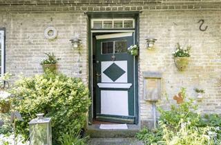 Doppelhaushälfte kaufen in 24357 Güby, Historische Doppelhaushälfte unter Reet auf einem romantischen Grundstück mit eigenem Bachlauf