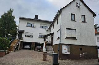 Haus kaufen in 35796 Weinbach, Zwei Einfamilienhäuser auf einem großzügigen Grundstück mit Doppelgarage