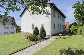 Wohnung kaufen in Zentstraße, 97702 Münnerstadt, 4-Zimmer-Erdgeschosswohnung mit großem Garten und Garage im 2 FH in Münnerstadt