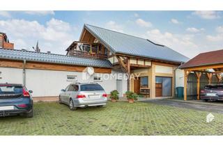 Einfamilienhaus kaufen in 06766 Bitterfeld-Wolfen, Komfortabel und ruhig: Einfamilienhaus mit Wintergarten, 4 Garagen, großem Carport und Stellplatz