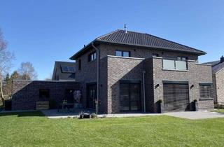 Einfamilienhaus kaufen in 26689 Apen, Neubau mit Lebensqualität – Einfamilienhaus in Apen nahe Natur & Zentrum