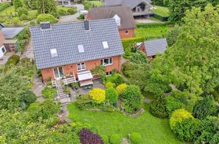 Einfamilienhaus kaufen in 24960 Glücksburg, Modernisiertes Einfamilienhaus mit herrlichem Garten und Baulücke in begehrter Lage am Mühlenteich