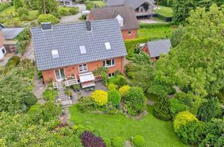 Einfamilienhaus kaufen in Seestraße 25, 24960 Glücksburg, Modernisiertes Einfamilienhaus mit herrlichem Garten und Baulücke in begehrter Lage am Mühlenteich