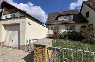 Doppelhaushälfte kaufen in 97753 Karlstadt, Doppelhaushälfte mit Garten und Garage – Potenzial für einen zusätzlichen Anbau!
