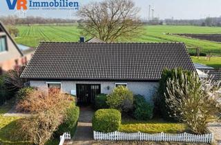 Haus kaufen in Süderstraße 34, 24855 Jübek, Attraktiver Winkelbungalow in Feldrandlage: Ebenerdiges Wohnen, Südgarten, Garage und Carport