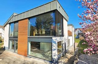 Einfamilienhaus kaufen in 97337 Dettelbach, Exklusives Doppeleinfamilienhaus mit Wellnessbereich und zusätzlichem Gebäude