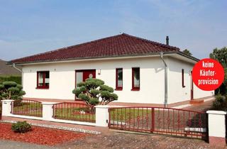 Einfamilienhaus kaufen in 17039 Woggersin, Woggersin - HORN IMMOBILIEN ++ Woggersin nur 5 km bis Neubrandenburg, großer Winkelbungalow mit Doppelgarage und Kamin