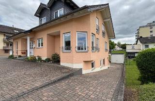 Mehrfamilienhaus kaufen in 54634 Bitburg, Bitburg - zentral gelegene Erdgeschosswohnung mit Terrasse und Garage