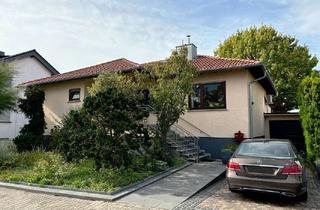 Haus kaufen in Am Oberwiesenweg 12, 64572 Büttelborn, Tipptopp gepflegter Walmdachbungalow mit Einliegerwohnung in Massivbauweise