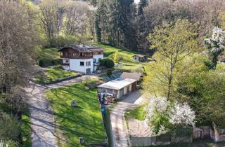 Haus kaufen in 64747 Breuberg, Wohnoase mit Burgblick: Großzügiges Zweifamilienhaus mit Traumgrundstück in Bestlage von Breuberg!