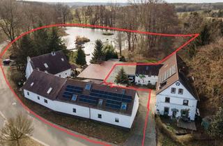 Haus kaufen in 06905 Bad Schmiedeberg, Drei exklusive Einfamilienhäuser mit Privatsee, Insel & modernster Technik