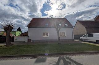 Haus kaufen in 06901 Schleesen, Vierseitenhof mit großem Garten, Garagenvielfalt und Bachlauf - vermietetes Zweifamilienhaus