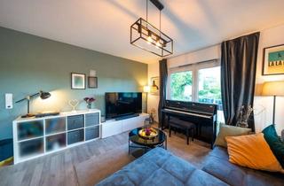 Wohnung kaufen in 61194 Niddatal, Hochwertige 2-Zimmer-ETW mit Garten und Kamin