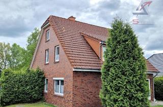 Haus kaufen in 26639 Wiesmoor, Zweifamilienhaus in schöner ruhiger Kanallage