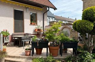 Einfamilienhaus kaufen in 76661 Philippsburg, Einfamilienhaus mit idyllischem Innenhof, großer Garage, Carport und Top-Lage