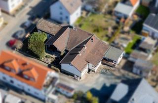Anlageobjekt in 65428 Rüsselsheim, 2 Wohneinheiten (WEG geteilt) im Bungalowstil zusammenhängend mit großer Wohnfläche