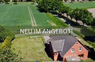 Haus kaufen in 31606 Warmsen, Zweifamilienhaus mit Anbau und Vermietungspotenzial auf weitläufigem Grundstück