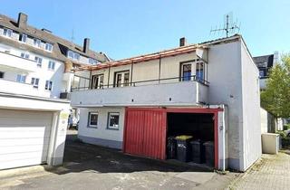 Einfamilienhaus kaufen in 53937 Schleiden, Sanierungsobjekt mit Potential: Freistehendes Einfamilienhaus mit Lagerflächen in zentraler Lage