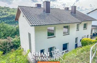 Doppelhaushälfte kaufen in 34385 Bad Karlshafen, Charmante Doppelhaushälfte in Bad Karlshafen - Wohnen mit Potenzial in Hanglage und Weserblick!