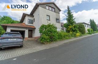 Haus kaufen in 34582 Borken, Borken - Wohnoase für die ganze Familie: Frei stehendes Haus mit großem Garten und Wintergarten!