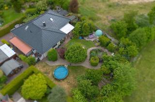 Haus kaufen in 21493 Elmenhorst, Eleganter Winkelbungalow mit Gartenidylle und Ausbaureserve