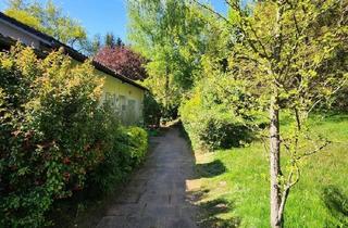 Wohnung kaufen in 67659 Kaiserslautern, Kaiserslautern - Geräumige Parterre-Eigentumswohnung mit eigenem Grundstück und Parkflächen in ruhiger Ortsrandlage